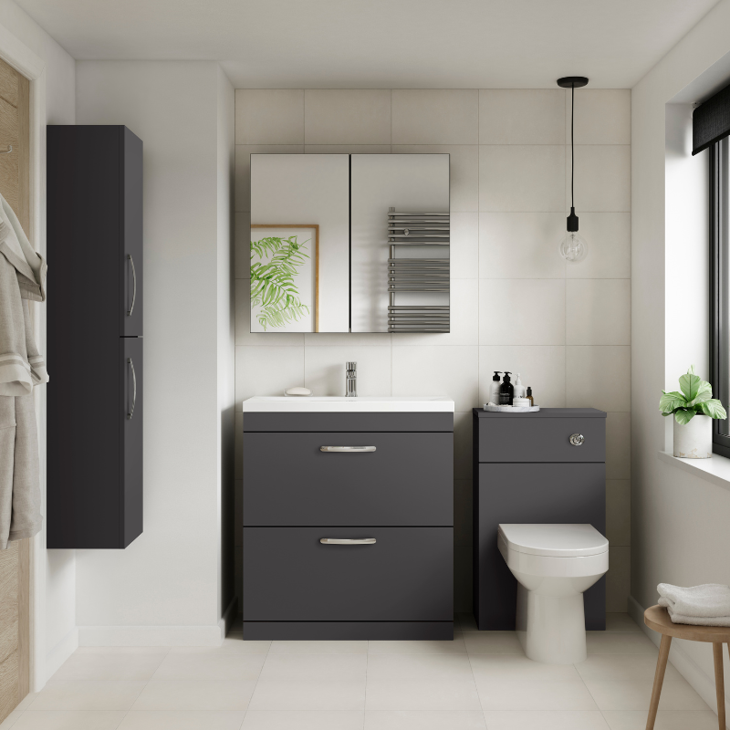 Modern bathroom with dark gray vanity unit, white toilet, and mirror.